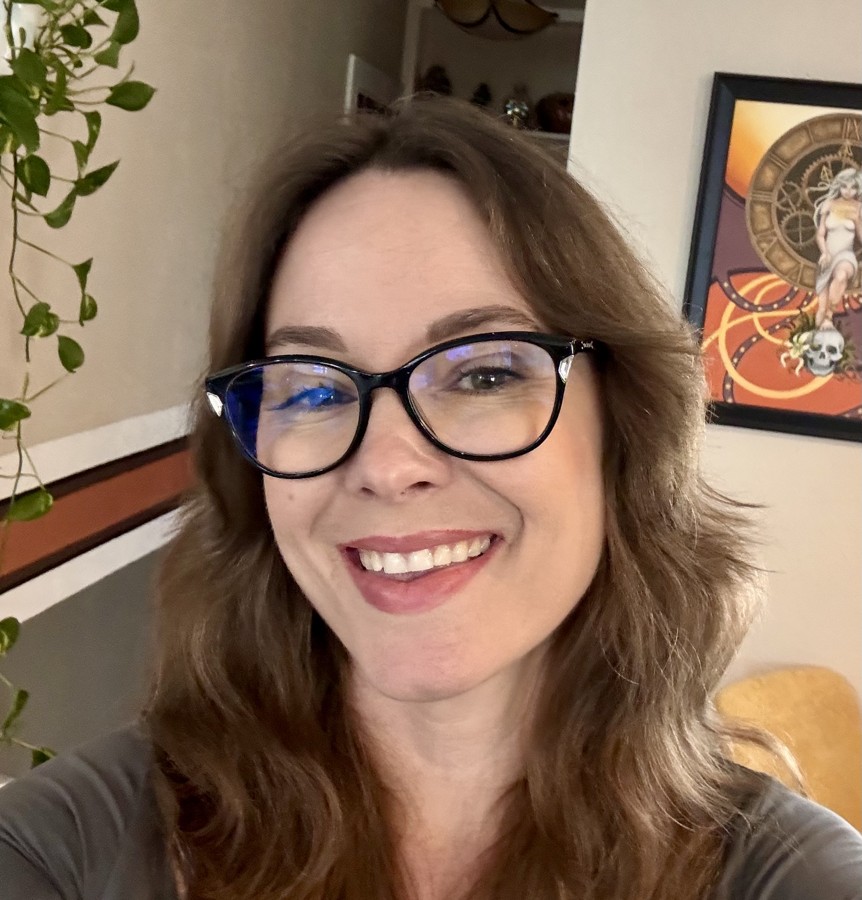 Bonnie Crews smiling, wearing glasses